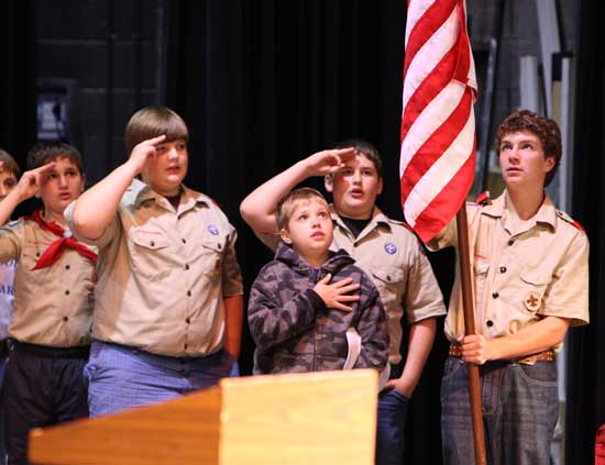 From left: Scouts Ed Talanian, John Hubert, Ryan Robinson, Christopher Melby, and Leo Pero recite the Pledge of Allegiance to kick off the ceremony.