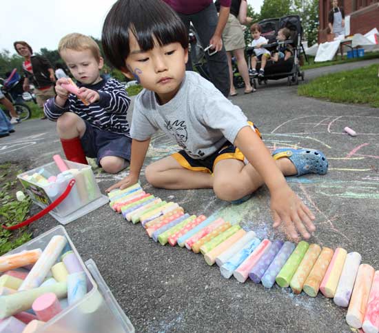 Maxwell Zhao lines up 36 pieces of chalk at the library ice cream social.
