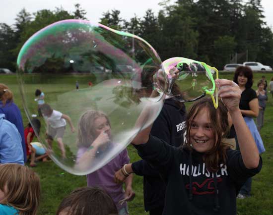 Elly vandeVaart creates a giant bubble.