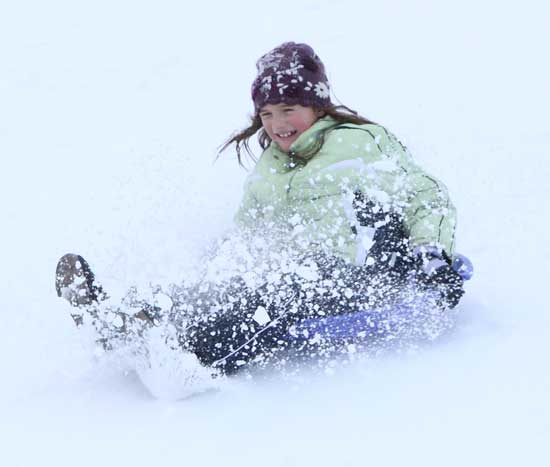 Taylor Tracey flies down the hill behind Bromfield in a flurry of snow.