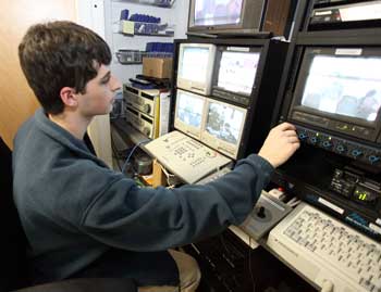 Bromfield senior Casey Clark mans the controls during a taping for local cable TV of a recent school committee meeting in Town Hall. (Photo by Lisa Aciukewicz)