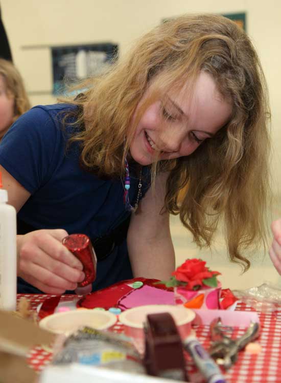 Fifth-grader Caroline Noyes puts the finishing touches on her creation.
