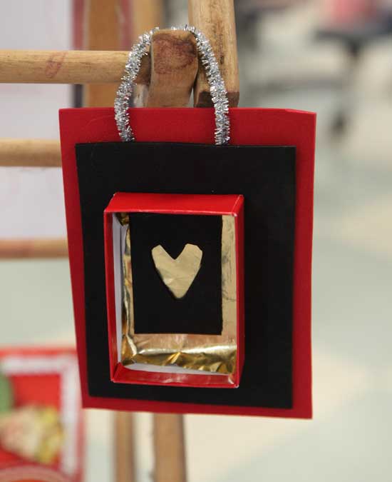 A finished Valentine hangs on a drying rack.
