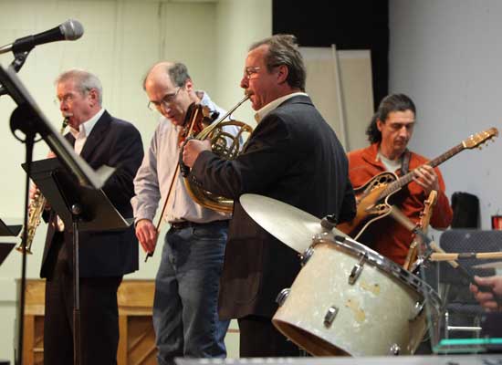 From left, musicians Glenn Williams, David Kassel, Jim Phelan, and Francis Begue join in an end-of-the-night jazz jam