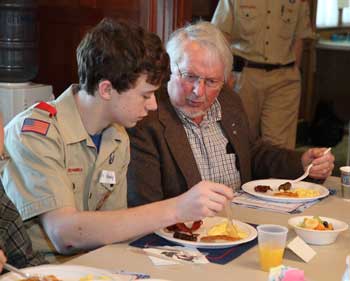 Boy Scout Ryan Kennedy (left) chats with Owen Sponagle as they eat breakfast at the annual Boy Scouts’ breakfast for senior men held at the Hildreth House on March 7. (Photo by Lisa Aciukewicz)