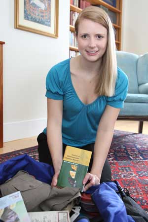 Emily Dorward packs her bags for a 27-month stay in Rwanda. (Photo by Lisa Aciukewicz)