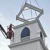 Generous business owner hoists restored balustrade to top off Historical Society’s belfry