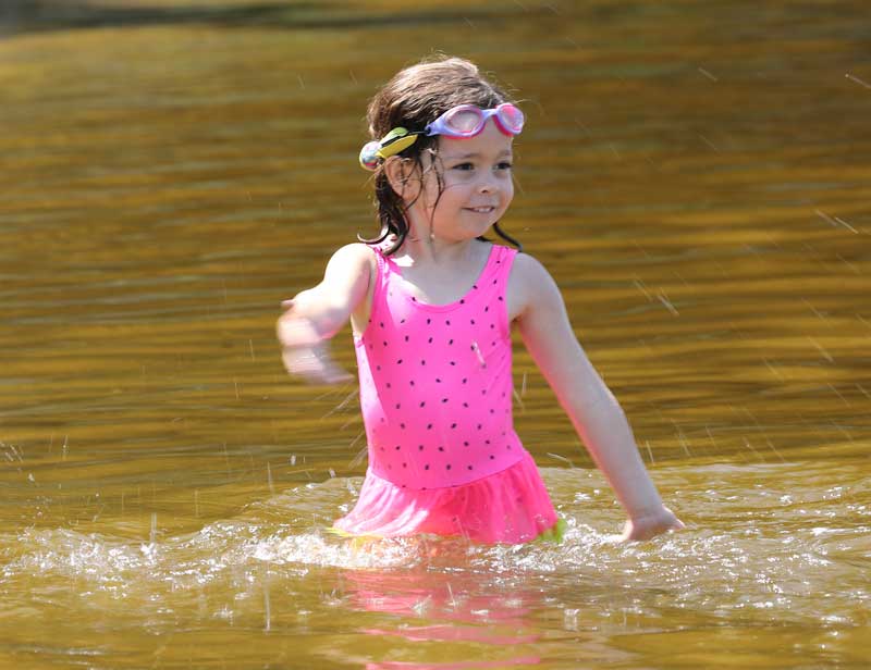 After weeks of rain, a sunny day delights Bare Hill Pond beachgoers ...