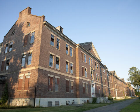 Vacant for three decades, the buildings of Vicksburg Square show signs of decay, including Revere Hall. (Photo by Lisa Aciukewicz)