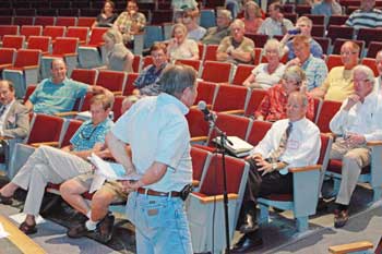 Selectman Ron Ricci explains the BOS recommendation to cap the betterment fees for the town center sewer project at the Special Town Meeting on Aug, 18. (Photo by Lisa Aciukewicz)
